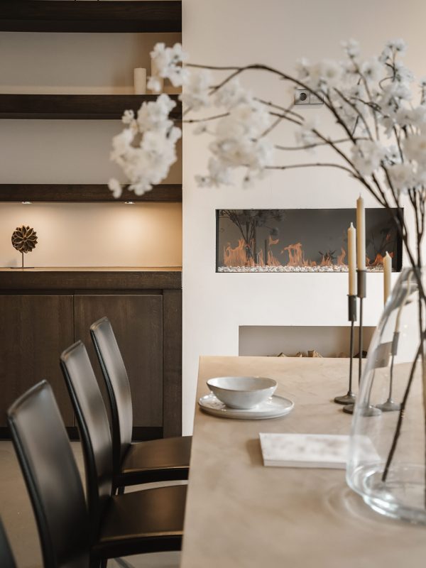 Stylish home interior design of dining zone with table and chairs in modern apartment